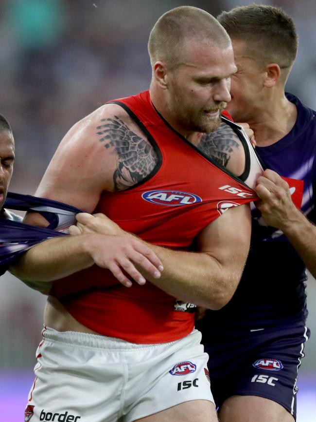 Jake Stringer tussles with a couple of Dockers