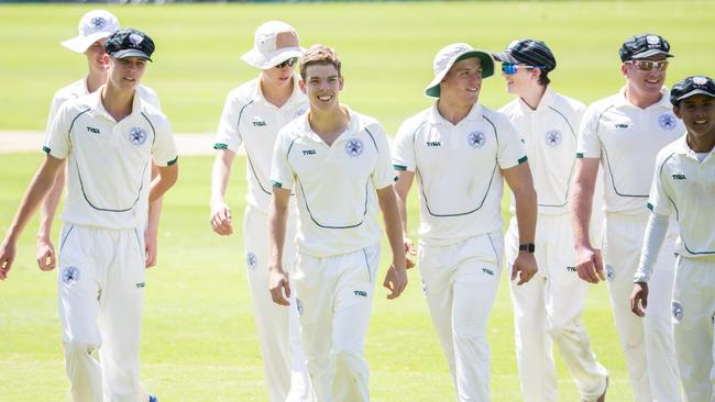 BBC players come off the field happy after dismissing Nudgee. (AAP Image/Richard Walker)