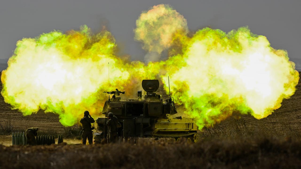 An Israeli Defence Force artillery soldier covers his ears as a shell is fired towards Gaza on October 11, 2023. Picture: Alexi J. Rosenfeld/Getty Images