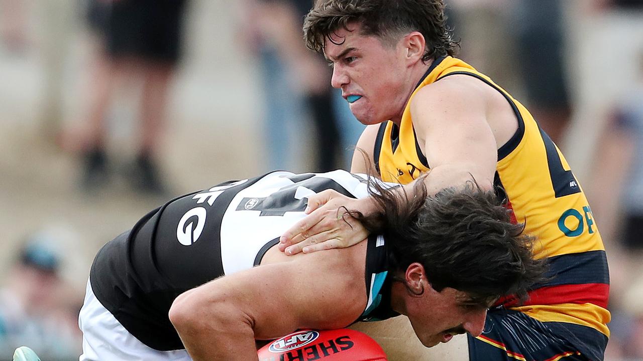 Ned McHenry tries to stop Power opponent Lachie Jones. Picture: AFL Photos via Getty Images