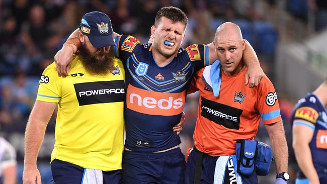 Jai Arrow of the Titans is taken from the field injured during the Round 14 NRL match between the Gold Coast Titans and the New Zealand Warriors at Cbus Super Stadium on the Gold Coast, Friday, June 14, 2019. (AAP Image/Dave Hunt) NO ARCHIVING, EDITORIAL USE ONLY