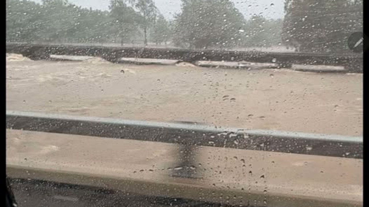 702mm in 24hrs: Power lines falling across Bruce Hwy