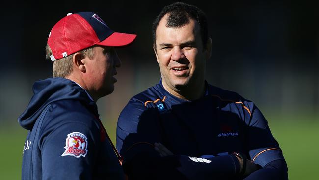 Sydney Roosters coach Trent Robinson with Waratahs coach Michael Cheika during the Sydney Roosters rugby league and Waratahs rugby combined training session at Moore Park, Sydney. Pic Brett Costello