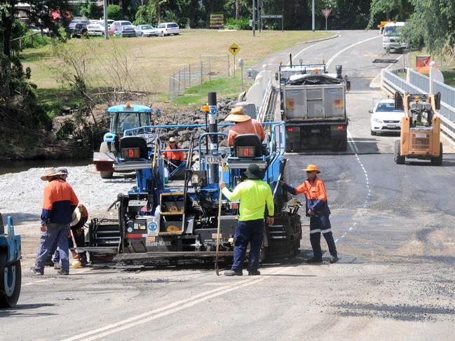 Gympie Regional Council workers and contractors put the finishinf touches to repairs to the Imbil Bridge that will open today.  Photo Craig Warhurst / The Gympie Times