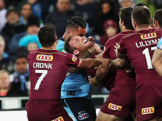 Andrew Fifita was given 10 minutes in the bin for cuddling Queensland's Gavin Cooper around the neck after he scored try. Picture. Phil Hillyard