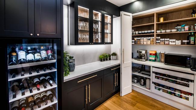 A black kitchen, designed and built by Nobby Kitchens.