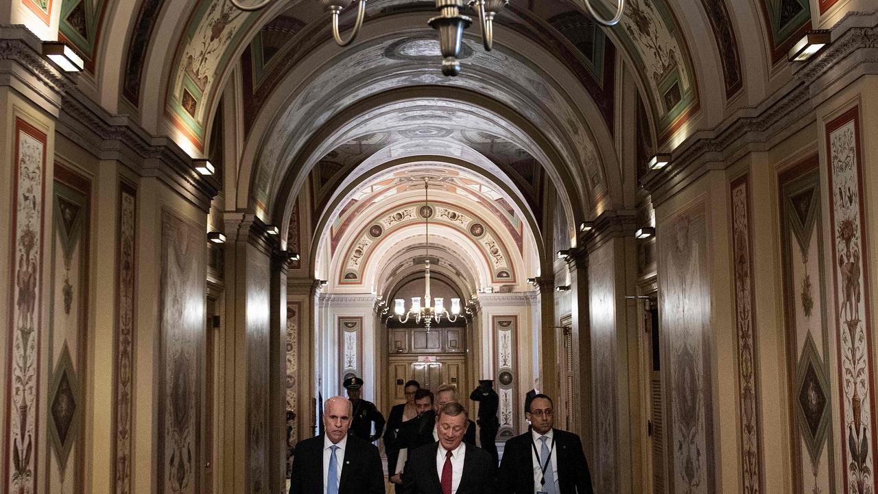 US Supreme Court Chief Justice John Roberts (C) leaves the US Capitol, January 16, 2020, in Washington, DC. Picture: Brendan Smialowski / AFP.