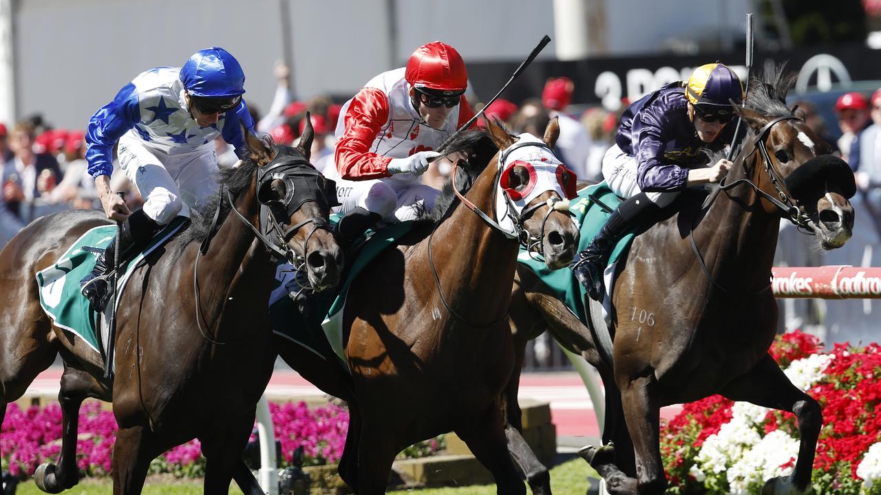 Red Aces (centre) digs deep to beat Opening Address (right) and King Of Thunder in the Vase at The Valley. Picture: Michael Klein