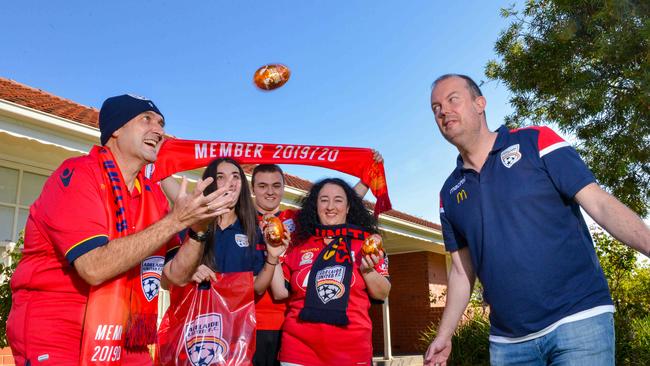 Adelaide United chairman Piet van der Pol delivering goodies to Reds members Nick Tsokkos, daughter Antonia, son Mos and wife Nicky of West Beach, April 9, 2020. Picture: Brenton Edwards.