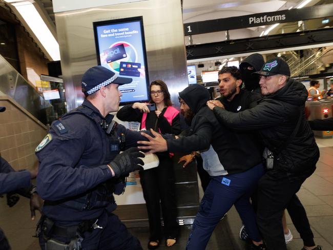 Pro-Palestine supporters clash with police at Circular Quay Station in Sydney en route to a rally at Town Hall. Picture: David Swift