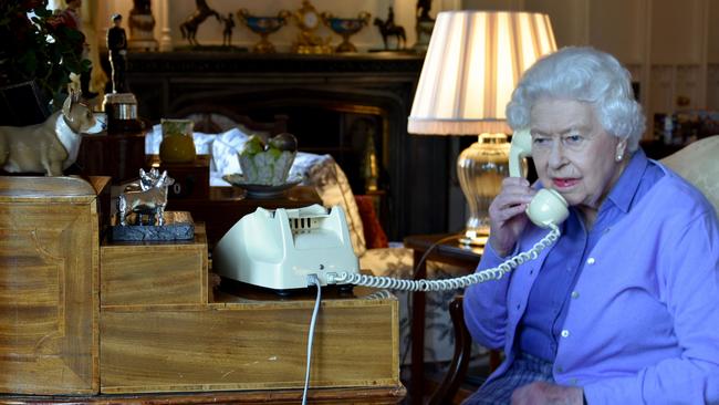 This 2020 photo shows the Queen holding her weekly audience with then-Prime Minister Boris Johnson. Picture: BUCKINGHAM PALACE / AFP