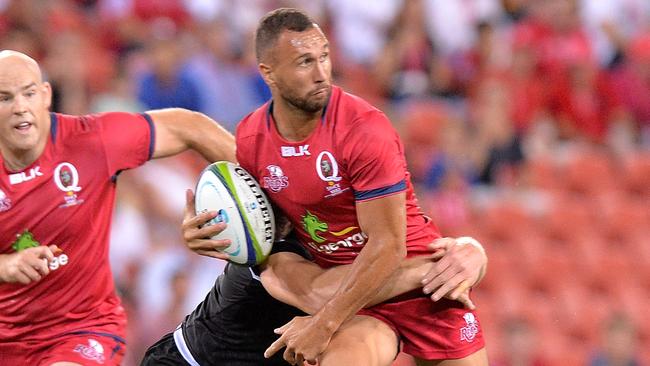 Reds star Quade Cooper looks to get a pass away on Friday night.