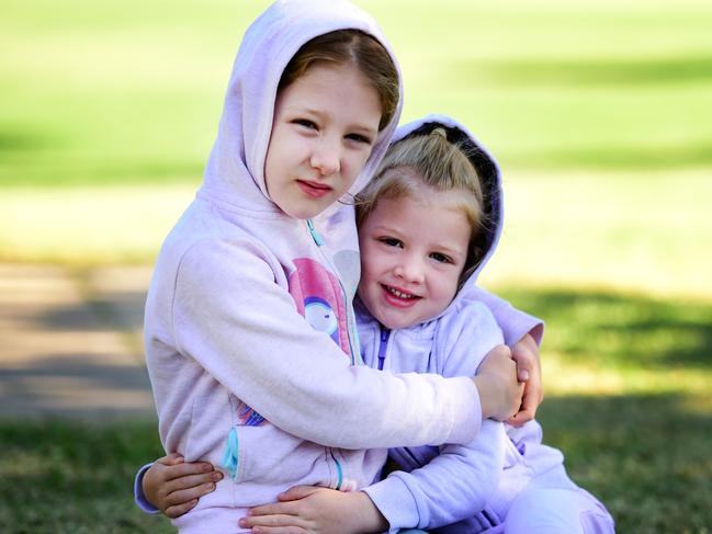 Weather; Annabel 6 and Zoe Graham 4 rugged up on the Strand.