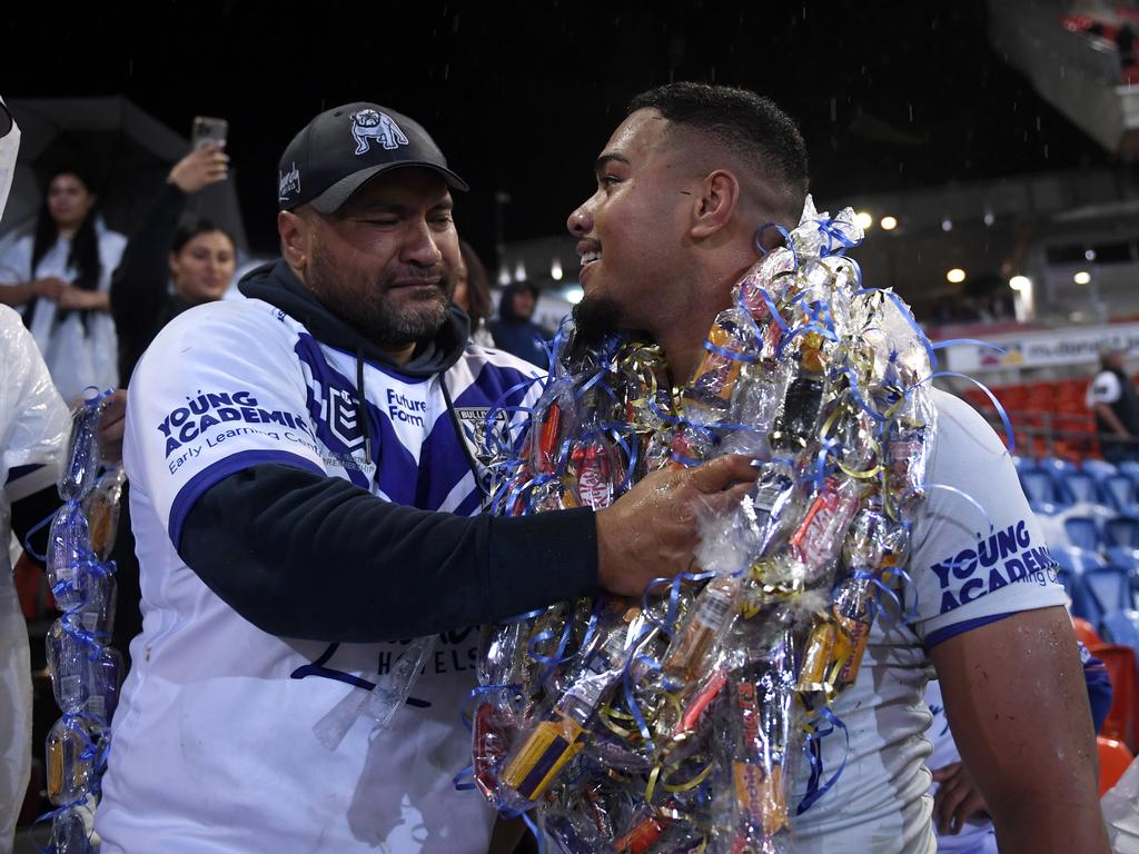 Lipoi Hopoi celebrates with family after his NRL debut. Picture: NRL Images