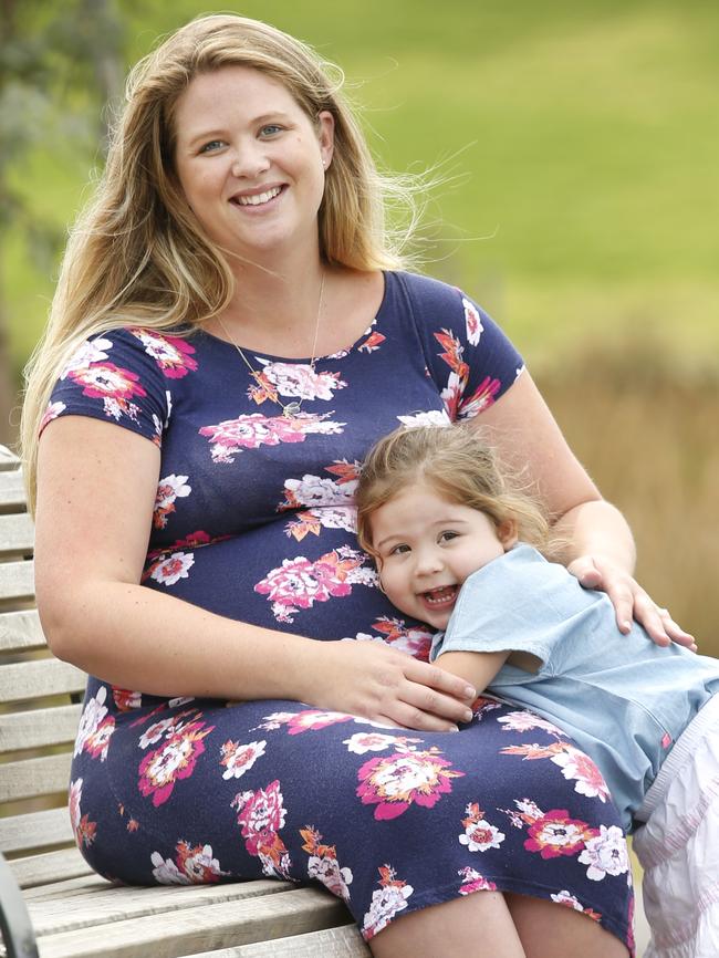 Shae Finnigan pregnant with her second child, sits with daughter Amelia 3 who will be receiving cord blood from her sibling when they are born. Picture: David Caird.