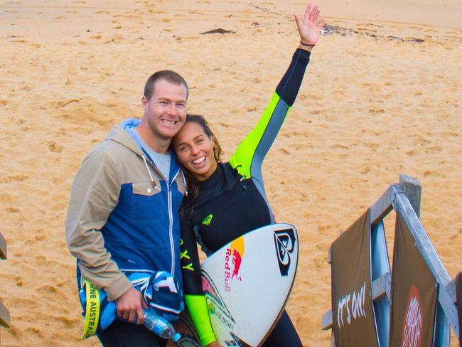 DT Sport. St George Illawarra forward Trent Merrin with girlfriend and surfing guru Sally Fitzgibbons at Bell's Beach. Pic: Supplied