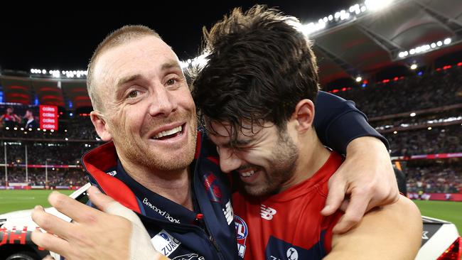 PERTH. 25/09/2021. AFL Grand Final.  Melbourne vs Western Bulldogs at Optus Stadium, Perth.  . Simon Goodwin, senior coach of the Demons hugs Christian Petracca of the Demons  after siren    . Photo by Michael Klein