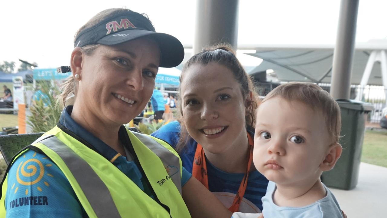 Volunteer Tegan Philpott with Shae Ward and Shae's baby Isaac, eight months.