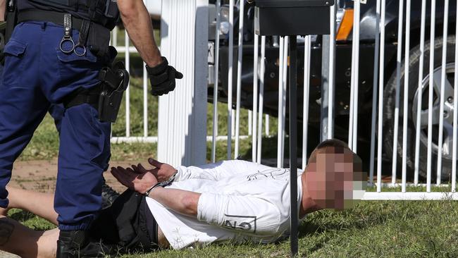 Police make an arrest in Gipps Rd, Greystanes on Thursday. Picture: Justin Lloyd