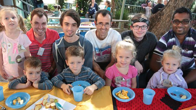 Matt Pardy, Liam Isle, Darren Moore, Nicholas Larkin and Nitesh Narayan enjoy learning early childhood education with Katherine Hall (4), Lucas Hudson (2), Isaac Hudson (4), Bella Thomas (5) and Marli Thomas (2). Picture: Robert Pozo