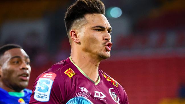 Queensland Reds Jordan Petaia splits the Fiji Drua's defence during the Super Rugby match between the Queensland Reds and Fijian Drua at Suncorp Stadium in Brisbane on March 12, 2022. (Photo by Patrick HAMILTON / AFP) / -- IMAGE RESTRICTED TO EDITORIAL USE - STRICTLY NO COMMERCIAL USE --