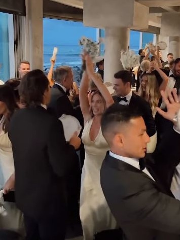 Robbie and the bridal party dance their way into the reception.