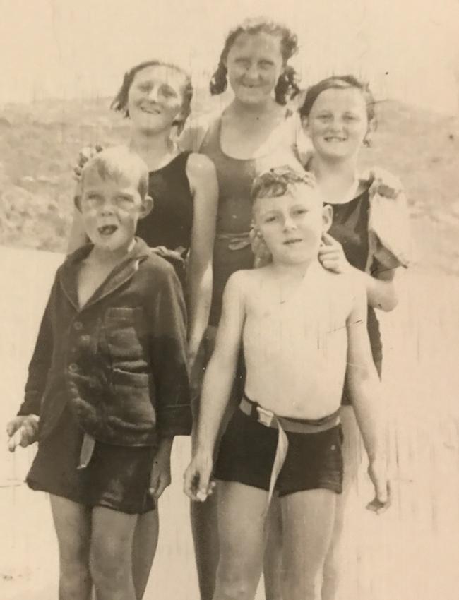 Mrs Hughes (back row left) with family on the beach 1939.