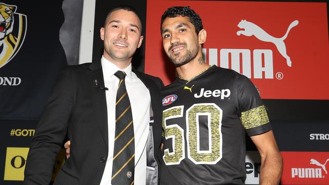 Marlion Pickett, right, with Shaun Grigg, the player he replaced on the Tigers’ list, after his jumper presentation ahead of the grand final. Picture: Robert Cianflone/AFL Photos