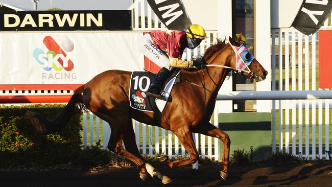 Race 7 at Fannie Bay Racecourse. Winning horse Saturday Sorcerer ridden by jockey Paul Denton.