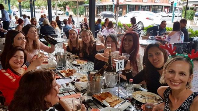 Lucy Paveley (far right) with her nursing course friends at a Christmas drinks last year at the Old Lion pub. Picture: Supplied