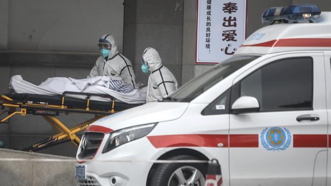 Medical staff transfer patients to Jin Yintan hospital on January 17, 2020 in Wuhan, Hubei. Picture: Getty Images