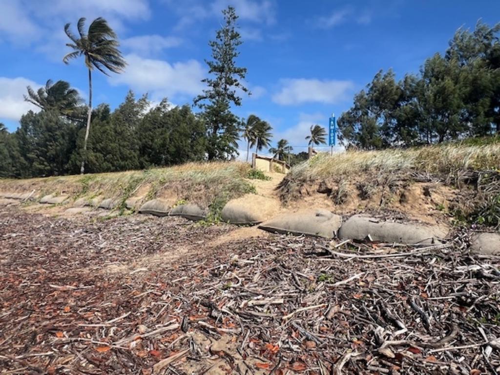The once buried geobags remained exposed as storm surges and high tides tore through the Midge Point coastline. Photo: Gina Passfield