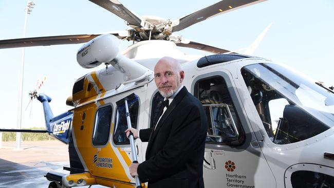 Chief Executive Officer Mick Frewen gives the CareFlight chopper a polish before the ball Pic Katrina Bridgeford.