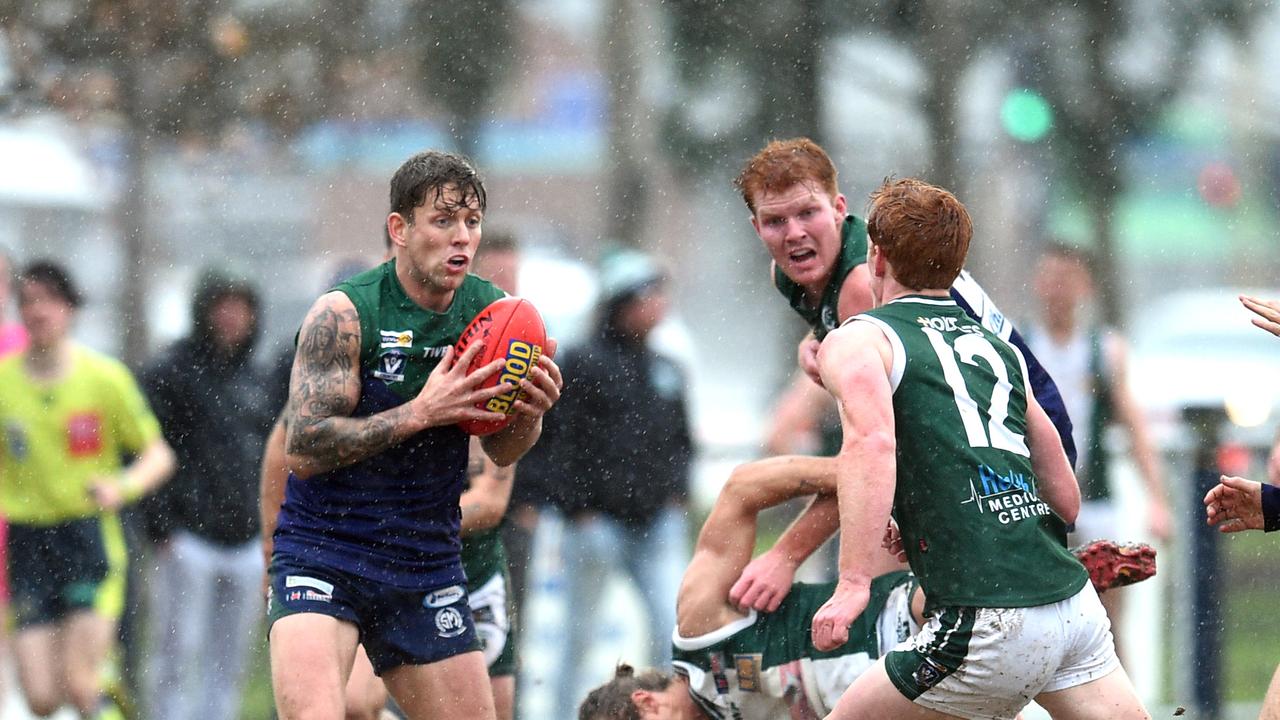 Rain teems down during St Mary’s clash against Bell Park.