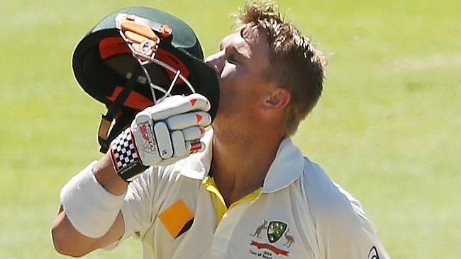 David Warner kisses the badge on his helmet after scoring his second hundred of the third Test.