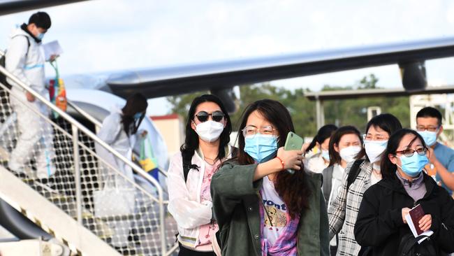 <span id="U703120600337kFE" style="font-stretch:94.5%;">The first returning flight of 64 international students arrives in Darwin. </span>Picture: Katrina Bridgeford