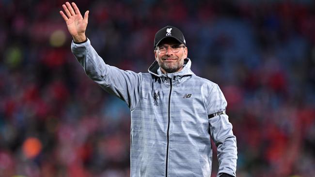 Liverpool coach Jurgen Klopp waves to the crowd.