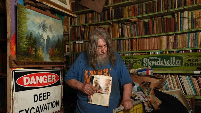 Mr Wells with part of his collection, which he does not want to leave. Picture: Naomi Jellicoe
