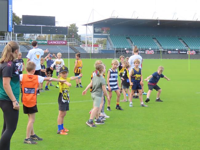 Kids taking part in drills at the Devils school holiday clinic at Launceston on Tuesday. Picture: Jon Tuxworth