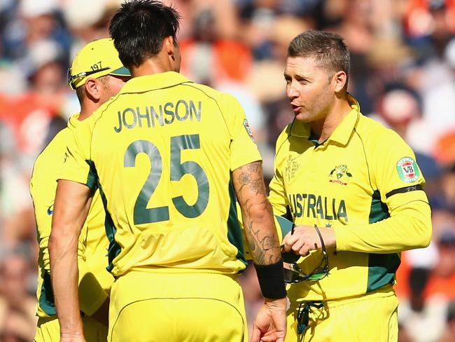 Michael Clarke gets hisa point across to Mitchell Johnson.