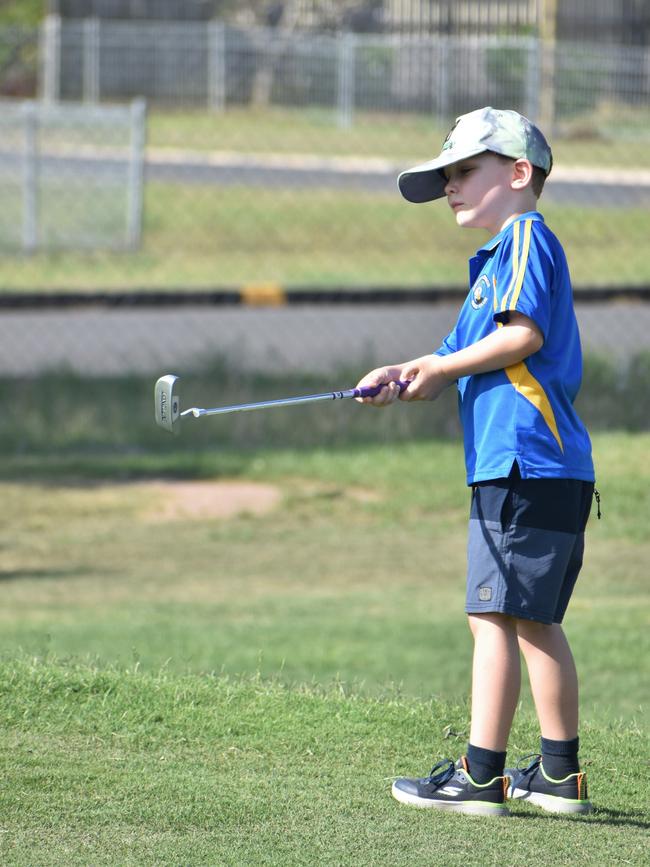 Rockhampton's Martin Applewaite (boys six years and under) watches his put closely during play at the US Kids Golf Foundation Australian Open at the Rockhampton Golf Club on September 27.
