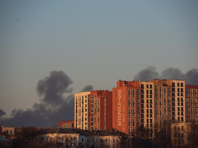 Smoke is seen above apartment blocks in Lviv, Ukraine. Lviv's mayor said on Telegram that the airport was not hit, but an area nearby. Picture: Getty Images