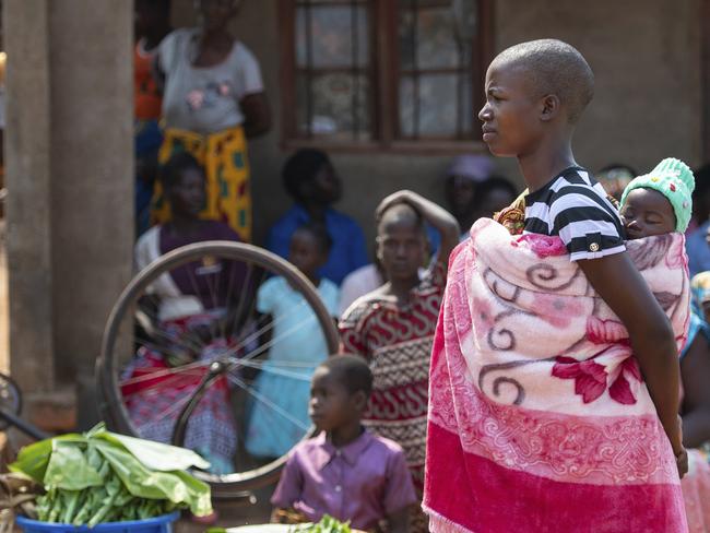 Residents of Blantyre await the arrival of Britain's Prince Harry during a visit to the Mauwa Health Centre in Blantyre, Malawi. Picture: AP