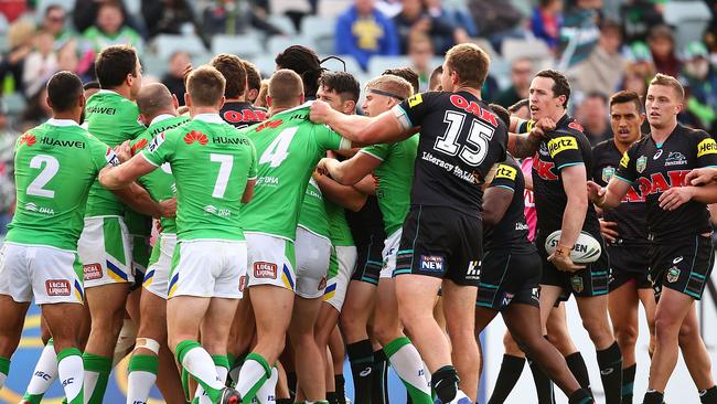 Raiders and Panthers players scuffle.