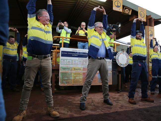 The Prime Minister of Australia Scott Morrison has spent the second day of his visit to Western Australia at the Christmas Creek mine site in The PIlbara. PIctured -Prime MInister joins FMG CEO Andrew Forrest and workers in morning stretches at the site in the states North West on April 16, 2021. Picture - Justin Benson-Cooper / The West Australian