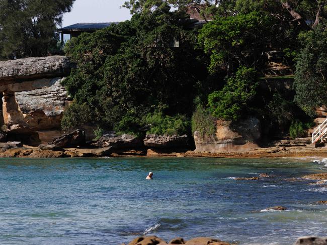 An elderly man swims at Gunyah Beach in Bundeena, meters from where the shark attack happened on Friday afternoon. Picture: Max Mason-Hubers