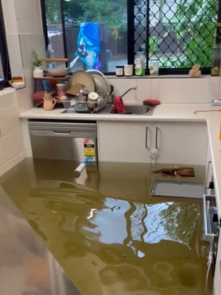 The only road in and out, Holloway Beach Rd, was ‘washed into the ocean’, with an SES ferry to Cairns currently the only way off Holloways Beach. Picture: Supplied