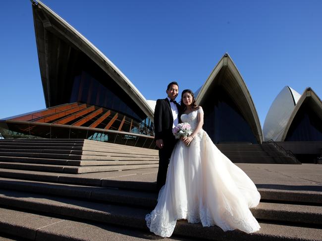 The couple say ‘I do’ on the steps of the Sydney Opera House this morning. Picture: Ross Schultz