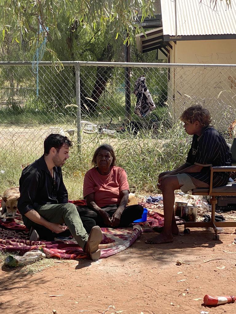 Remote Housing Minister Chansey Paech sits with Aunty Freda Jurra and her grandson at Little Sisters town camp. Pictures: Supplied