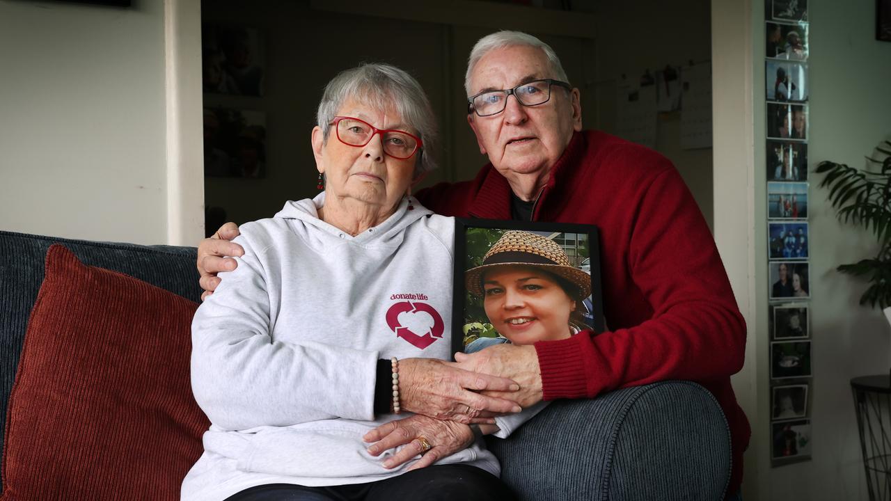 Bruce and Yvonne Mackintosh hold a photo of daughter Nicole, who donated her corneas to help two people see. Picture: David Caird